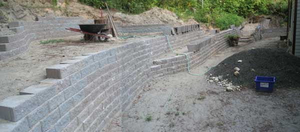 Photo collage showing backyard wall in August 2010